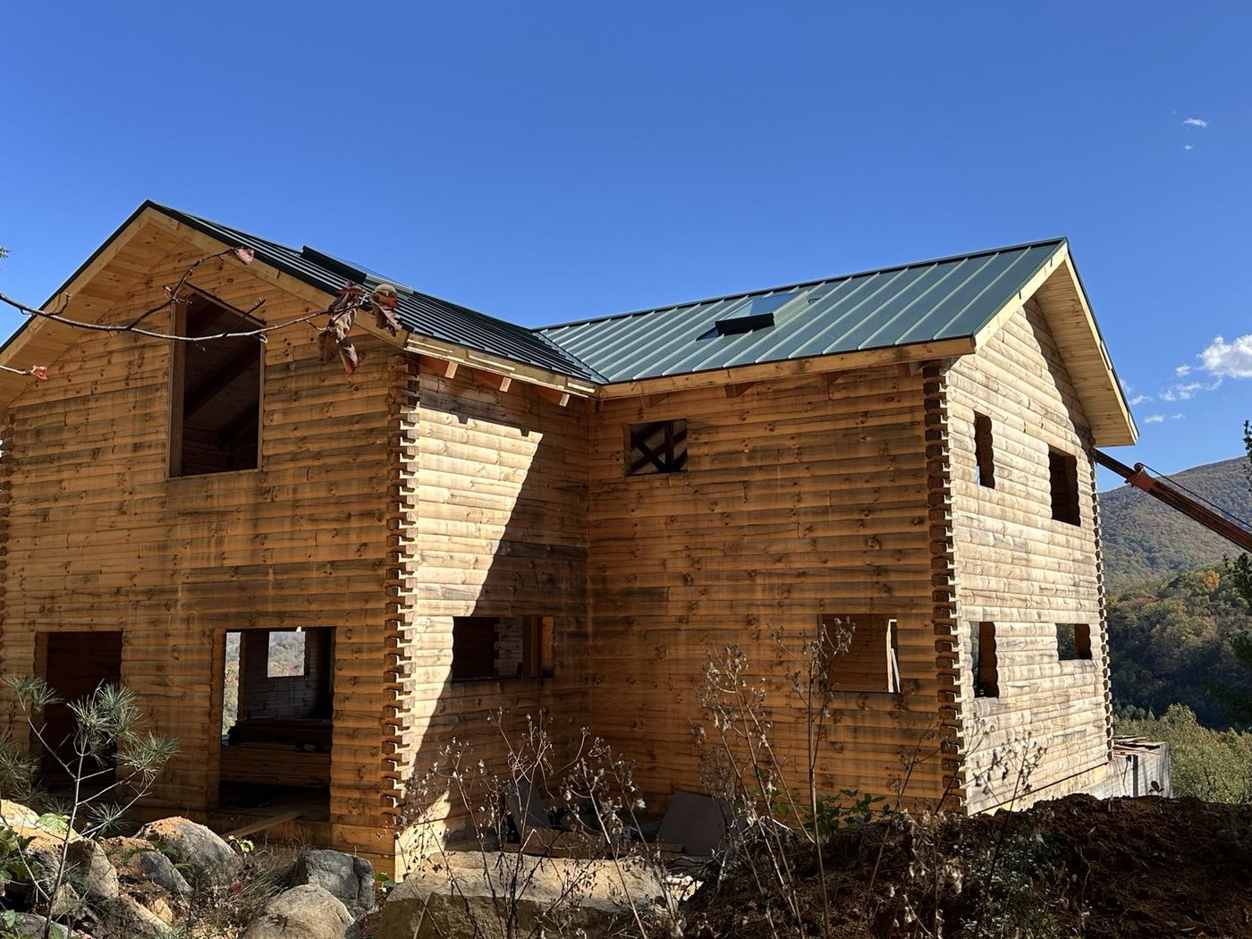 green standing seam roof valley and custom flashing details