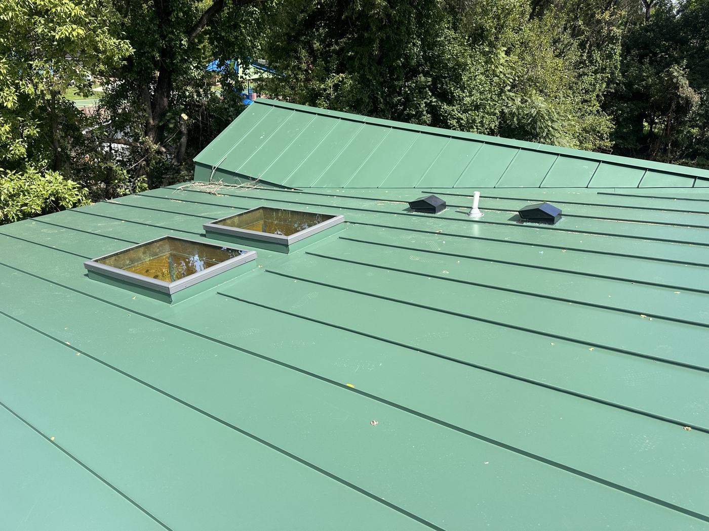 copper standing seam roof panels and metal roofing material close up